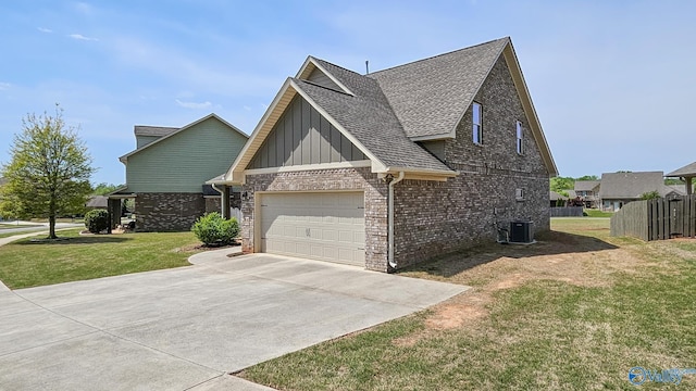 7607 NW Ashor Dr, Huntsville, AL 35806 - view of side of home with board and batten siding, a shingled roof, driveway, an attached garage, and brick siding