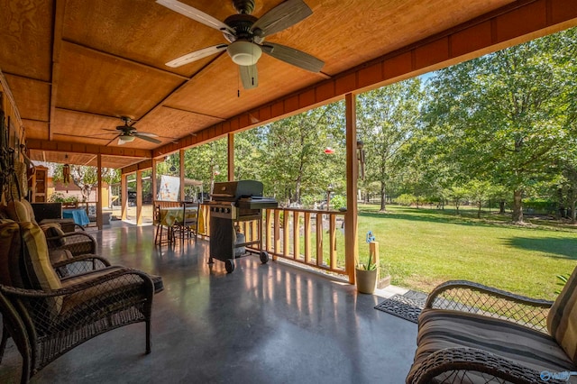 view of patio with ceiling fan and a grill