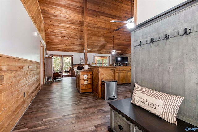 interior space featuring wood ceiling, wood walls, dark wood-type flooring, and high vaulted ceiling