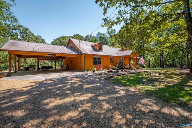 view of front of home featuring a carport