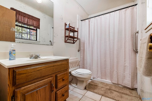 bathroom with tile patterned floors, a textured ceiling, vanity, and toilet