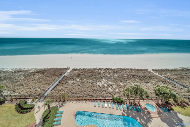 aerial view featuring a beach view and a water view