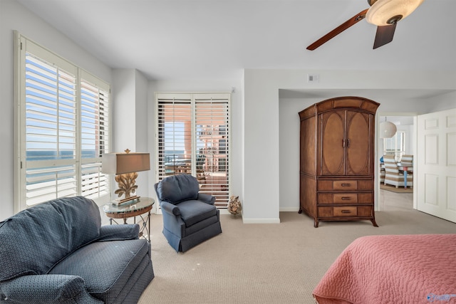 bedroom with carpet floors, ceiling fan, and baseboards