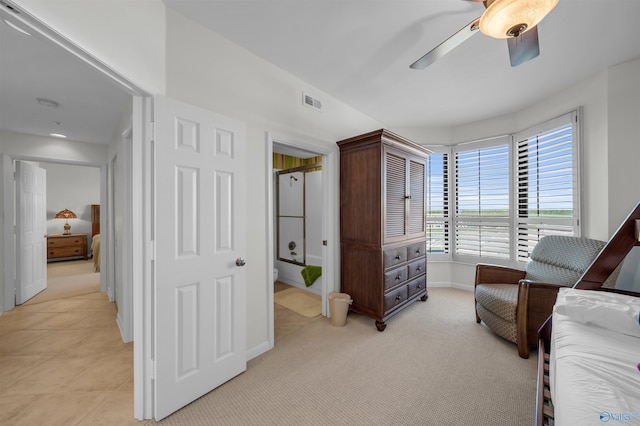 bedroom featuring a ceiling fan, light colored carpet, visible vents, and baseboards