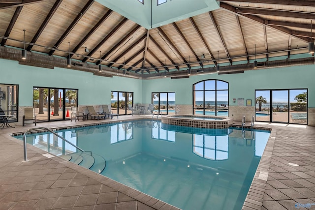 view of pool with a pool with connected hot tub