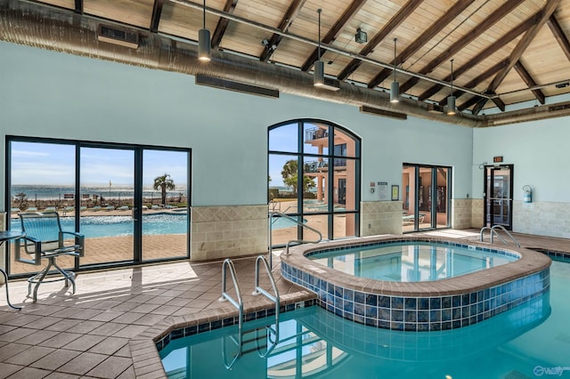 pool with an indoor in ground hot tub