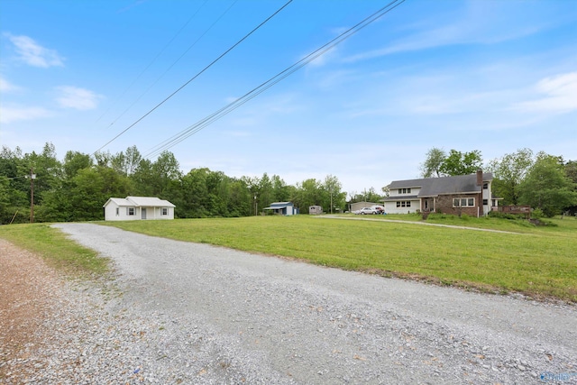 view of road featuring gravel driveway