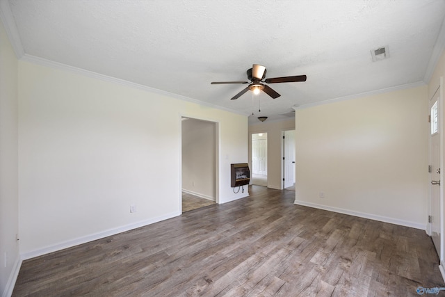 empty room featuring baseboards, visible vents, wood finished floors, and ceiling fan
