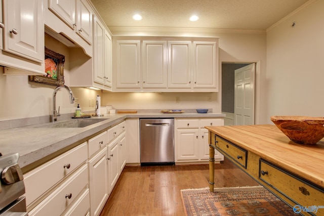 1625 River Bend Pl SE, Decatur, AL 35601 - kitchen featuring dishwasher, a sink, white cabinetry, ornamental molding, and recessed lighting