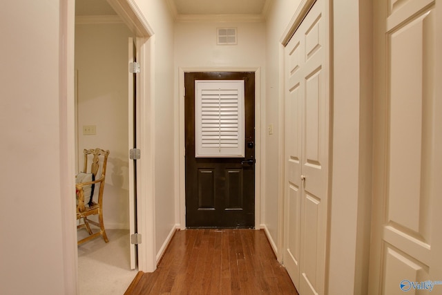 1625 River Bend Pl SE, Decatur, AL 35601 - entryway with crown molding, dark wood-type flooring, and baseboards
