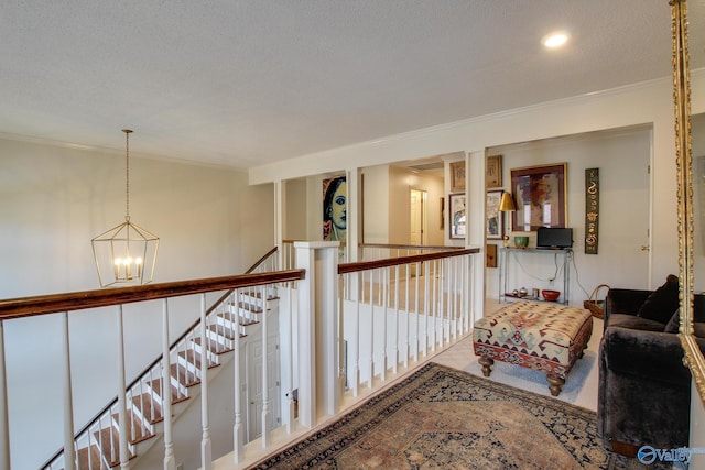 1625 River Bend Pl SE, Decatur, AL 35601 - hallway featuring a chandelier, crown molding, and an upstairs landing
