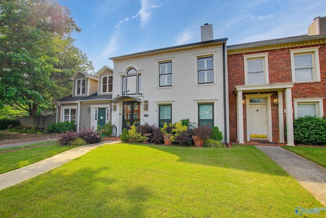 1625 River Bend Pl SE, Decatur, AL 35601 - view of property with a chimney and brick siding