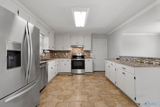 kitchen with light stone counters, white cabinetry, stainless steel appliances, and tasteful backsplash