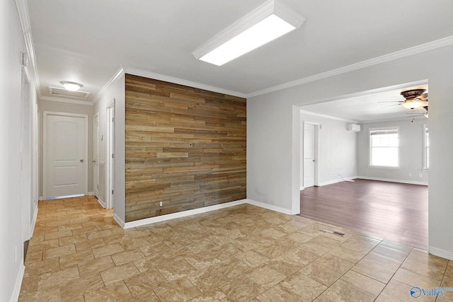 unfurnished room with ceiling fan, light wood-type flooring, and ornamental molding