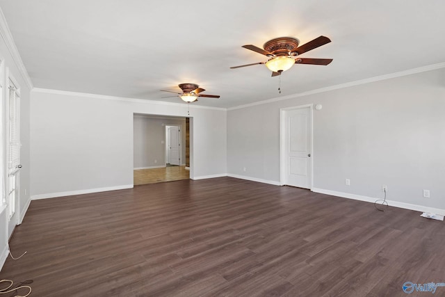 empty room featuring crown molding, ceiling fan, and dark hardwood / wood-style floors