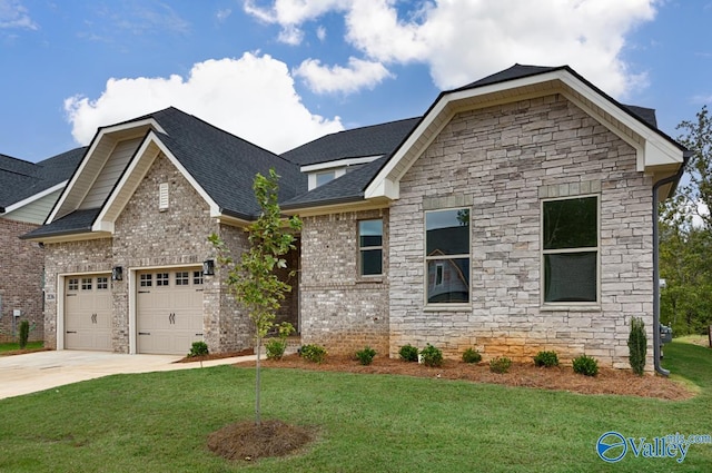 craftsman-style home with a garage and a front lawn