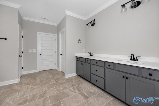 bathroom with ornamental molding and vanity