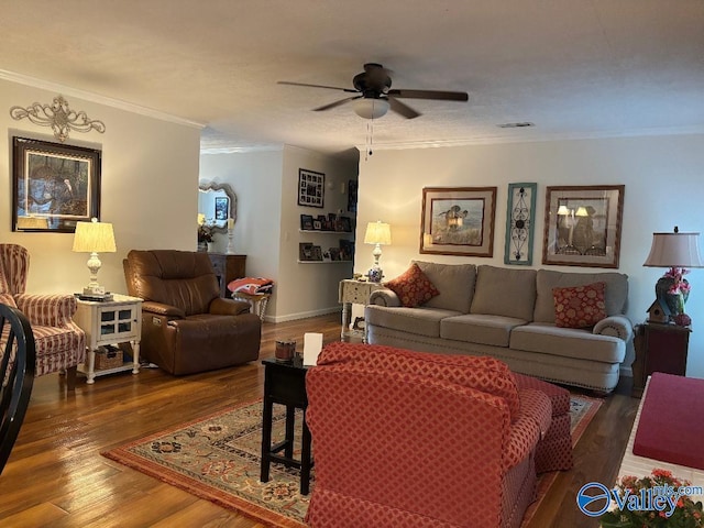 living room featuring crown molding, ceiling fan, and dark hardwood / wood-style flooring