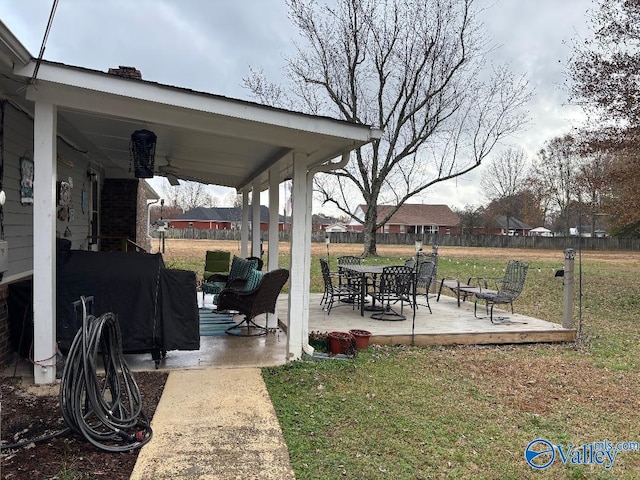 view of patio with ceiling fan and a grill