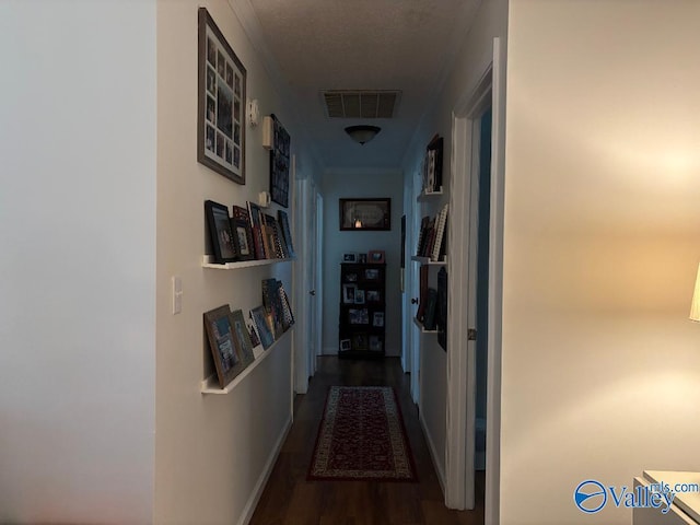 corridor with dark hardwood / wood-style floors