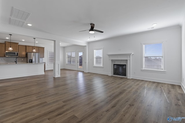 193 Chesire Cove Ln, New Market, AL 35761 - unfurnished living room featuring dark wood finished floors, a fireplace, baseboards, and a ceiling fan