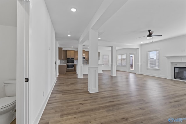 193 Chesire Cove Ln, New Market, AL 35761 - unfurnished living room featuring recessed lighting, wood finished floors, a ceiling fan, and a premium fireplace