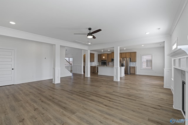 193 Chesire Cove Ln, New Market, AL 35761 - unfurnished living room featuring a ceiling fan, wood finished floors, stairway, and a fireplace