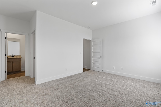 193 Chesire Cove Ln, New Market, AL 35761 - unfurnished bedroom with visible vents, carpet flooring, ensuite bath, and baseboards