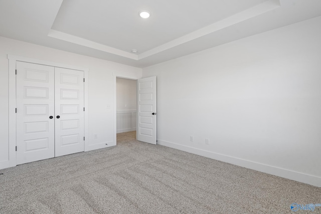 193 Chesire Cove Ln, New Market, AL 35761 - unfurnished bedroom with baseboards, carpet floors, a tray ceiling, recessed lighting, and a closet
