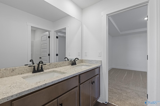 193 Chesire Cove Ln, New Market, AL 35761 - bathroom featuring double vanity, baseboards, and a sink