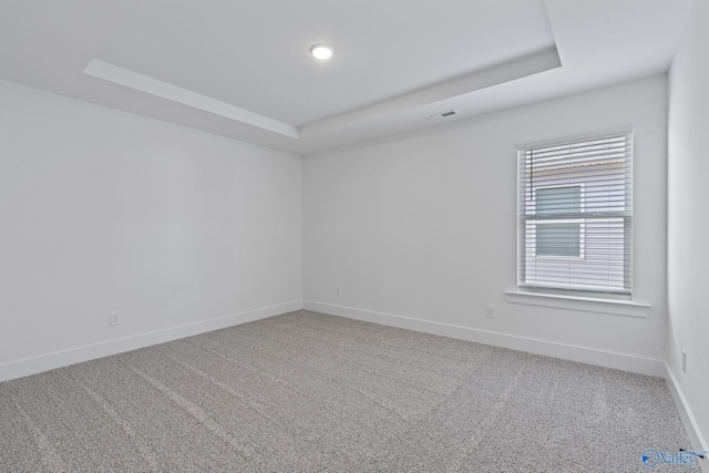193 Chesire Cove Ln, New Market, AL 35761 - spare room with visible vents, carpet, and a tray ceiling