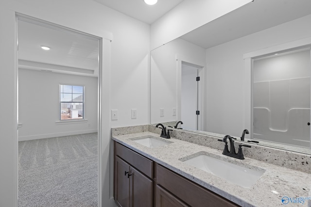 193 Chesire Cove Ln, New Market, AL 35761 - bathroom featuring double vanity, baseboards, and a sink