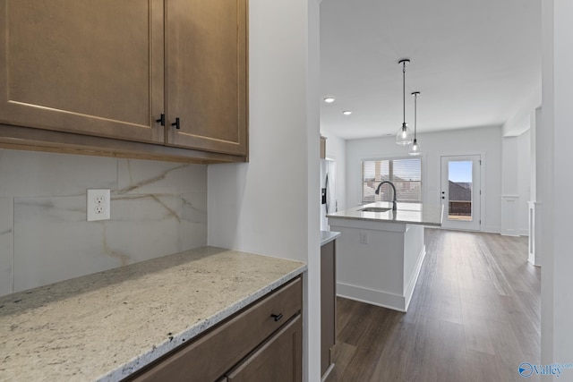 193 Chesire Cove Ln, New Market, AL 35761 - kitchen with a sink, stainless steel fridge, dark wood-type flooring, and light stone countertops