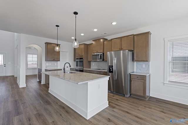 193 Chesire Cove Ln, New Market, AL 35761 - kitchen featuring a sink, arched walkways, plenty of natural light, and appliances with stainless steel finishes