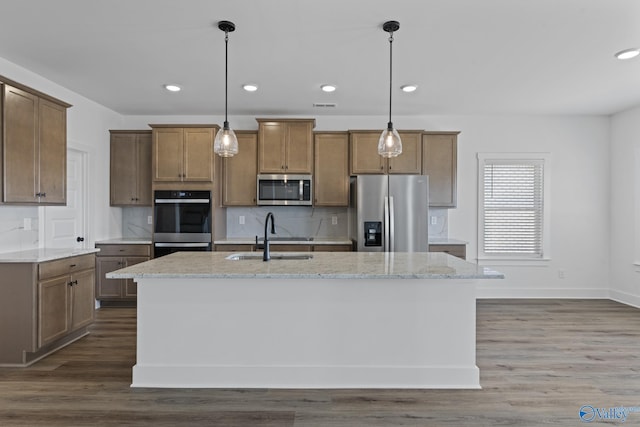 193 Chesire Cove Ln, New Market, AL 35761 - kitchen with a sink, tasteful backsplash, appliances with stainless steel finishes, and dark wood-style flooring