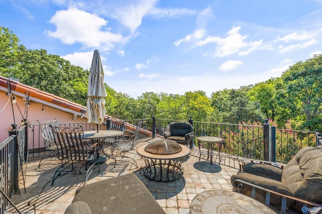 view of patio / terrace with a fire pit