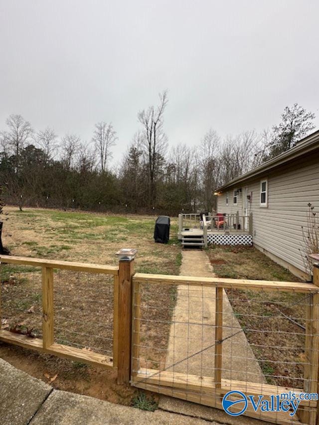 view of yard with a wooden deck