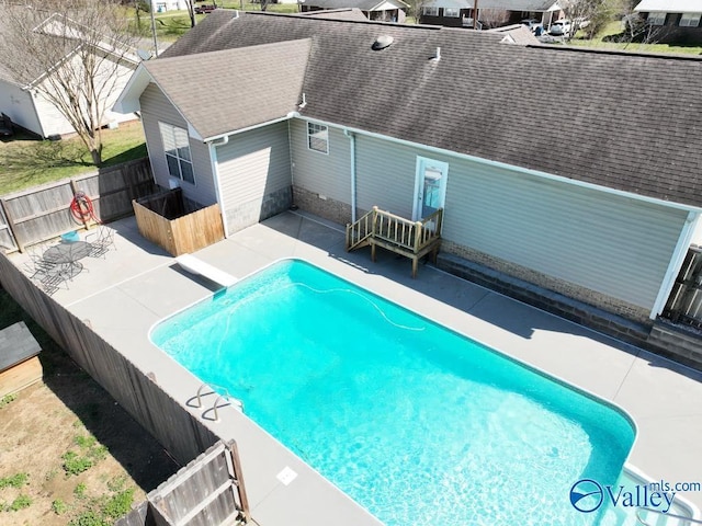view of pool with a fenced in pool, a fenced backyard, and a patio area