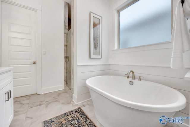 bathroom featuring independent shower and bath and vanity