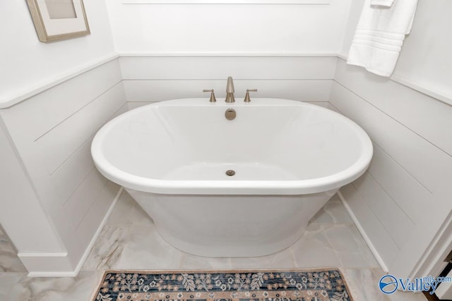 bathroom with a washtub