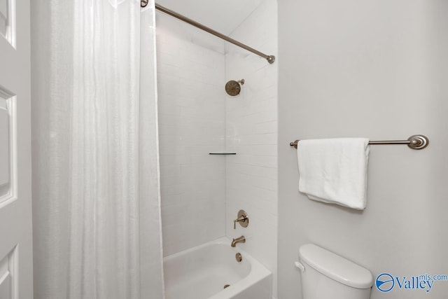 bathroom featuring shower / bath combination with curtain and toilet