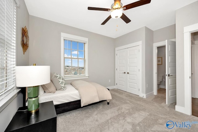 carpeted bedroom with a closet and ceiling fan