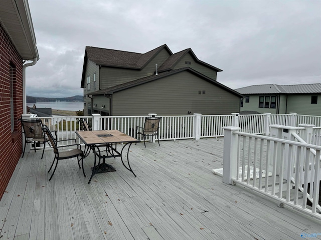 wooden terrace with a water view