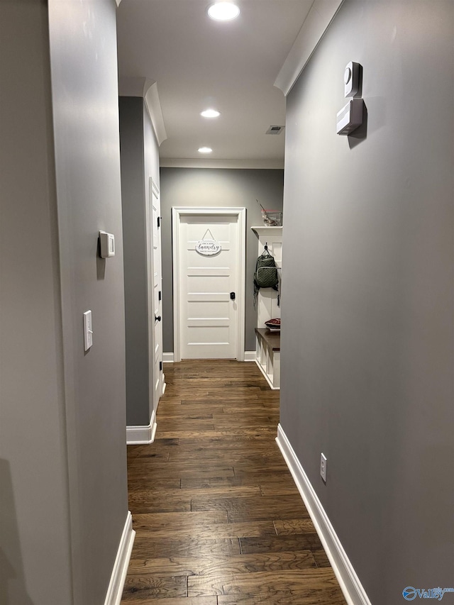 hall with dark hardwood / wood-style flooring