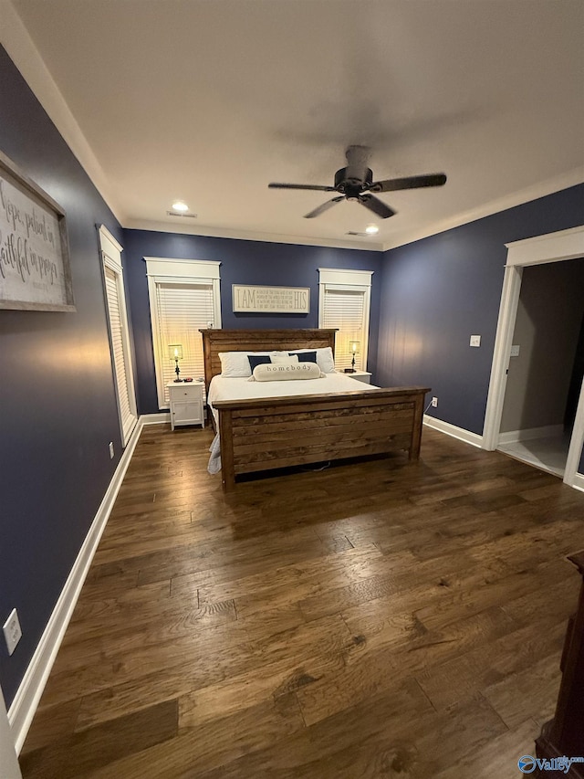 bedroom featuring ceiling fan, ornamental molding, and dark hardwood / wood-style flooring