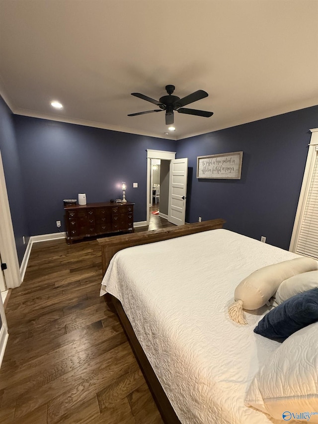 bedroom featuring ornamental molding, dark hardwood / wood-style floors, and ceiling fan