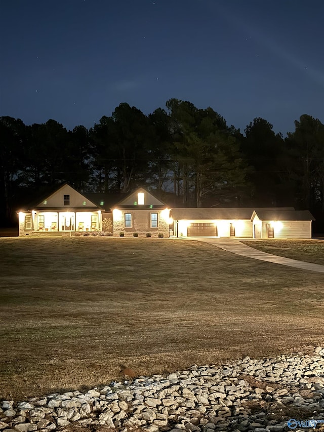 view of front of house with a yard