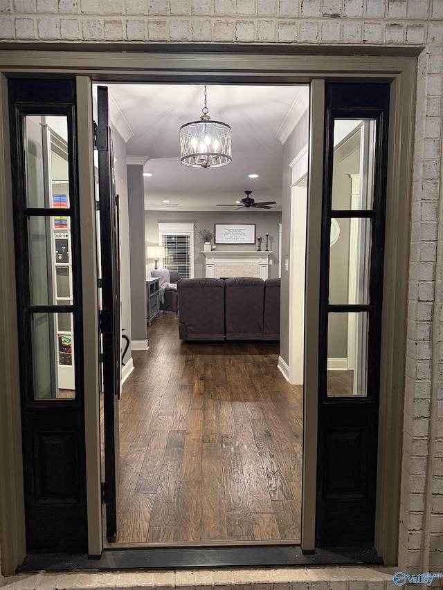 corridor featuring hardwood / wood-style flooring and crown molding