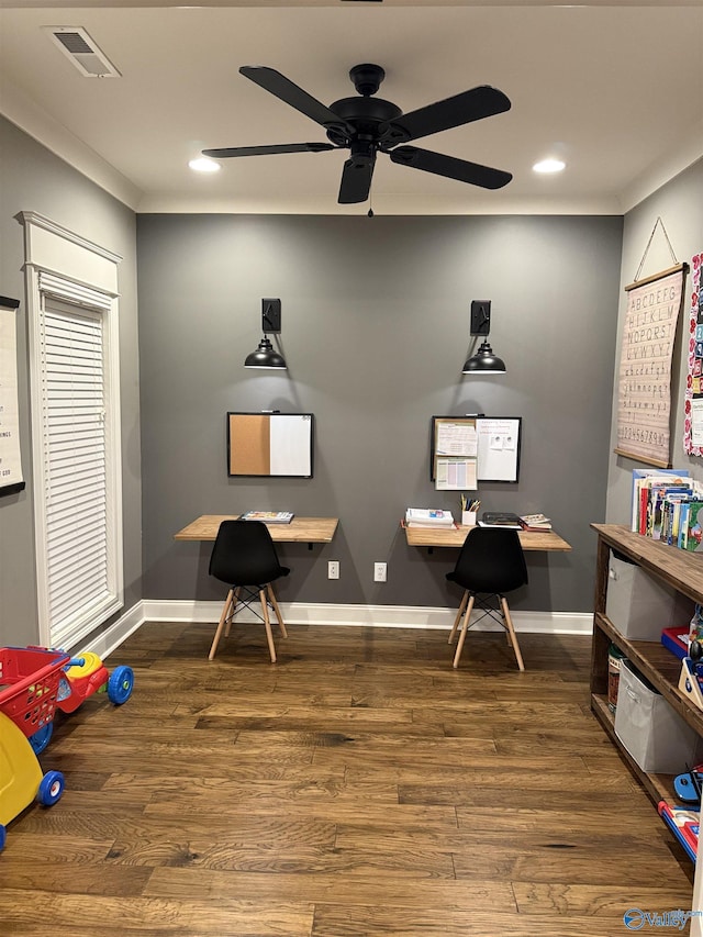 office area with dark wood-type flooring and ceiling fan