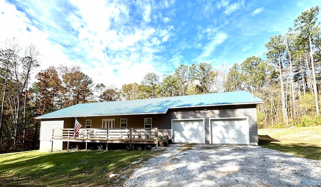 ranch-style house with a garage and a front lawn